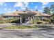 Inviting clubhouse entrance with well-maintained landscaping and a convenient circular driveway at 1201 Trisail Ln, North Myrtle Beach, SC 29582