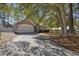 Inviting one-story home with brick driveway, manicured lawn, and mature trees providing shade at 1201 Trisail Ln, North Myrtle Beach, SC 29582