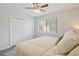 Bright bedroom featuring a ceiling fan, closet, and window at 128 Beaver Pond Loop # 48, Pawleys Island, SC 29585