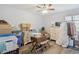 Bright bedroom with laminate flooring featuring a ceiling fan and two dressers at 128 Beaver Pond Loop # 48, Pawleys Island, SC 29585