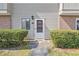 Well-kept entrance showcasing a white door, tidy shrubs, and easy access to the unit at 128 Beaver Pond Loop # 48, Pawleys Island, SC 29585