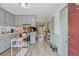 Charming kitchen flowing into the living area, offering modern appliances, and plenty of counter space at 128 Beaver Pond Loop # 48, Pawleys Island, SC 29585