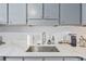 Well-organized kitchen counter featuring a deep stainless steel sink and modern faucet at 128 Beaver Pond Loop # 48, Pawleys Island, SC 29585