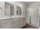 Bright bathroom featuring a double sink vanity, modern fixtures, and a glass-enclosed shower at 135 Harmony Ln., Myrtle Beach, SC 29588