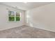 Cozy bedroom featuring plush carpeting, a large window with natural light, and neutral walls at 135 Harmony Ln., Myrtle Beach, SC 29588