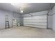 This spacious garage features a white door and concrete floors at 135 Harmony Ln., Myrtle Beach, SC 29588