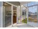 View of the screened patio with sliding door access to the modern kitchen and backyard at 135 Harmony Ln., Myrtle Beach, SC 29588