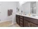 A modern bathroom featuring double sinks and a large mirror, along with tile floors at 135 Parmelee Dr. # A, Murrells Inlet, SC 29576