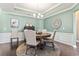 Charming dining room with hardwood floors, wainscoting, and a decorative chandelier at 135 Parmelee Dr. # A, Murrells Inlet, SC 29576