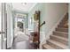 Inviting foyer with hardwood floors and an ornate entry bench at 135 Parmelee Dr. # A, Murrells Inlet, SC 29576