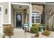 Charming front entrance with a decorative door, stone accents, and lush landscaping at 135 Parmelee Dr. # A, Murrells Inlet, SC 29576