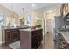 Beautiful kitchen featuring granite counters, stainless steel appliances, and rich wood cabinetry at 135 Parmelee Dr. # A, Murrells Inlet, SC 29576