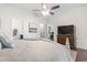 A bright main bedroom showing the attached bathroom and TV mounted to the wall at 135 Parmelee Dr. # A, Murrells Inlet, SC 29576