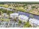 Aerial view of buildings, bridge, waterway and tennis courts at 1352 Villa Marbella Ct. # 1-104, Myrtle Beach, SC 29572