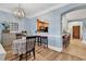 Charming dining area with a floral tablecloth, unique lighting, and an open view to the kitchen at 1352 Villa Marbella Ct. # 1-104, Myrtle Beach, SC 29572