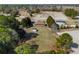 Wide aerial shot showcases a property with mature trees, a house, outbuilding, and expansive surroundings at 140 Flag Patch Rd., Loris, SC 29569