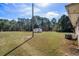 Large backyard featuring a utility shed and expansive grassy area at 140 Flag Patch Rd., Loris, SC 29569