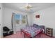 Cozy bedroom featuring pink carpet and a window with natural light at 140 Flag Patch Rd., Loris, SC 29569