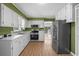 Galley kitchen featuring stainless appliances, wood grain flooring and lots of countertop space at 140 Flag Patch Rd., Loris, SC 29569