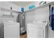 Functional laundry room featuring a washer, dryer, and water heater on vinyl flooring at 140 Flag Patch Rd., Loris, SC 29569