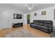 Well-lit living room with hardwood floors, a ceiling fan, and modern furnishings at 140 Flag Patch Rd., Loris, SC 29569