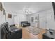 Bright living room with hardwood floors, ceiling fan, and a view of the front yard at 140 Flag Patch Rd., Loris, SC 29569