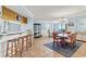 Dining area with seating for six, adjacent to a wet bar and living room at 1425 S Ocean Blvd. # 8-B, North Myrtle Beach, SC 29582