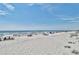 Beach view with many people relaxing under beach umbrellas at 14290 Ocean Highway # 207, Pawleys Island, SC 29585