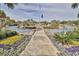 Scenic community fountain with American flag, lush landscaping and vibrant flowers; a true oasis of beauty at 14290 Ocean Highway # 207, Pawleys Island, SC 29585