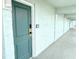 Hallway showing unit 207 with seafoam green walls and door at 14290 Ocean Highway # 207, Pawleys Island, SC 29585