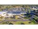 Aerial view of a clubhouse with outdoor seating area and nicely landscaped entrance at 178 Clubhouse Dr. # 3, Sunset Beach, NC 28468