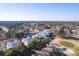 Stunning aerial shot overlooking lush golf course and surrounding neighborhood at 178 Clubhouse Dr. # 3, Sunset Beach, NC 28468