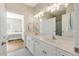 Double vanity in bathroom leading to a bedroom at 178 Clubhouse Dr. # 3, Sunset Beach, NC 28468