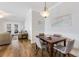 Open concept dining area featuring contemporary table set and hardwood floors at 178 Clubhouse Dr. # 3, Sunset Beach, NC 28468