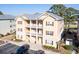 Attractive condo building with three levels, stairs, and parking at 178 Clubhouse Dr. # 3, Sunset Beach, NC 28468