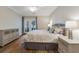 Bright main bedroom with balcony access and light gray accent furniture at 178 Clubhouse Dr. # 3, Sunset Beach, NC 28468