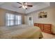 Bright bedroom with a large window, soft carpet, and a ceiling fan at 179 Heath Dr., Longs, SC 29568