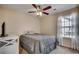 Bedroom with a ceiling fan, natural light from window, and a dresser with storage at 179 Heath Dr., Longs, SC 29568