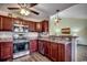 Charming kitchen featuring stainless steel appliances, granite countertops, and wood cabinets at 179 Heath Dr., Longs, SC 29568