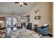 Comfortable living room with hardwood floors, tall ceilings, and a view to the backyard at 179 Heath Dr., Longs, SC 29568