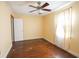 Cozy bedroom with hardwood floors, ceiling fan, and natural light from the window at 1841 Jasper St., Georgetown, SC 29440