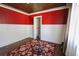 This bedroom features paneled walls, decorative red accent paint, and a unique ceiling design at 1841 Jasper St., Georgetown, SC 29440