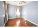 This bedroom features hardwood floors, natural light, and a neutral color scheme at 1841 Jasper St., Georgetown, SC 29440