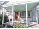 This home has a charming red door and a cozy front porch at 1841 Jasper St., Georgetown, SC 29440