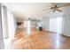 Bright living room featuring hardwood floors and two ceiling fans at 1841 Jasper St., Georgetown, SC 29440