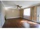 Bright living room with large window, ceiling fan, and hardwood flooring at 1841 Jasper St., Georgetown, SC 29440