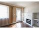 Cozy living room with large windows, hardwood floors, and a fireplace at 1841 Jasper St., Georgetown, SC 29440