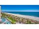 Scenic aerial view of the beach, ocean, pool, and palm trees at 2006 N Ocean Blvd. # 876, Myrtle Beach, SC 29577