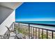 Balcony with chairs overlooking the beach and ocean at 2006 N Ocean Blvd. # 876, Myrtle Beach, SC 29577