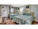 Charming bedroom featuring two beds, floral-patterned bedding, and ample natural light at 2006 N Ocean Blvd. # 876, Myrtle Beach, SC 29577